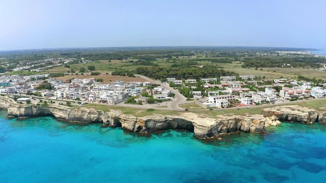 Aerial view, flight at Tower and bay of Roca Vecchia (Torre di Maradico), archaeological sites, Brindisi region, Apulia Italy