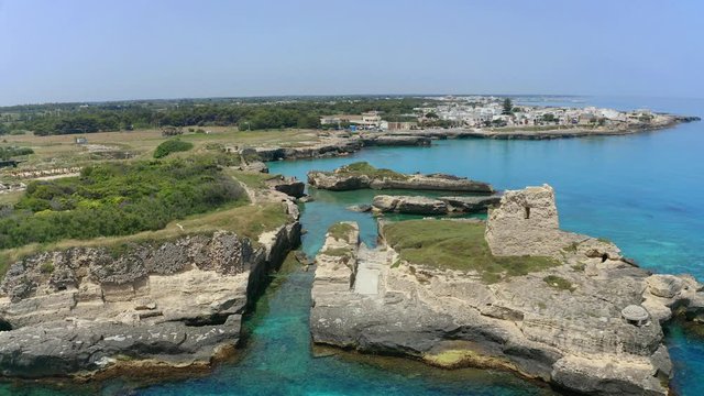 Aerial view, flight at Tower and bay of Roca Vecchia (Torre di Maradico), archaeological sites, Brindisi region, Apulia Italy