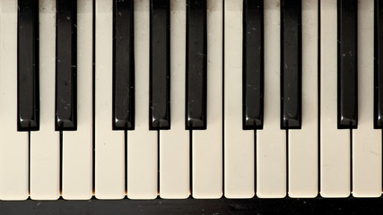 Close-up of a dirty old vintage effect piano keyboard