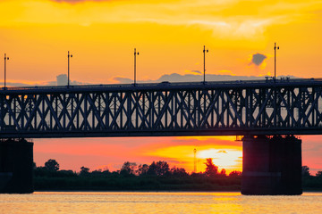 Bridge over the Amur river at sunset. Russia. Khabarovsk. Photo from the middle of the river.