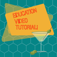 Word writing text Education Video Tutorial. Business concept for method of transferring knowledge through video Filled Cocktail Wine Glass with Olive on the Rim Blank Color Text Space