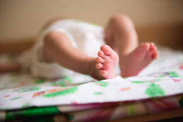 Fototapeta na wymiar Close up of newborn baby feet. Baby. Cozy. Family.