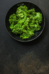 Fototapeta premium Healthy salad, leaves mix (green juicy snack). top food background - Image