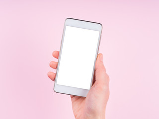 Hand with smartphone screen on pink