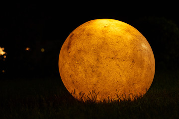 shining lantern in the shape of moon at night