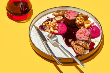 Roasted veal meat with jerusalem artichokes and sauce.