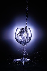 splash of water in glass isolated on white light