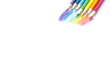 Color pencils with rainbow drawing isolated on white background. Top view.