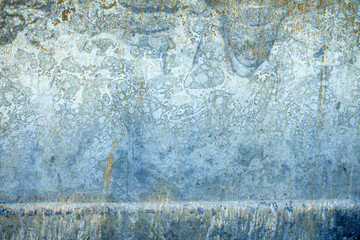 Detail of old burned  blue metal scrap with unusual pattern