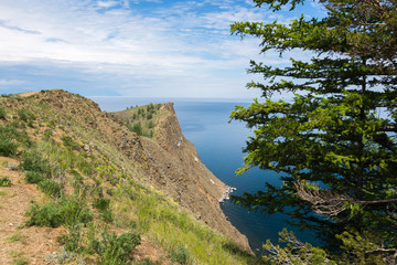 Fototapeta na wymiar Beautiful view of Lake Baikal on a clear summer day from the shore of Olkhon Island