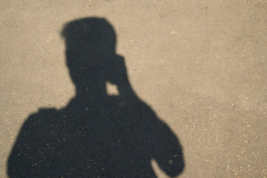 silhouette shadow man with a camera