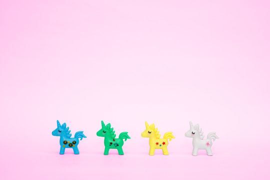 toy cute unicorn on a pink background