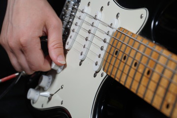 Guitar player on black background