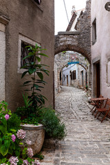 Fototapeta na wymiar View of typical istrian alley in Valle - Bale, Croatia