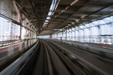 Fototapeta na wymiar motion-blurred view from a moving train running in tunnel
