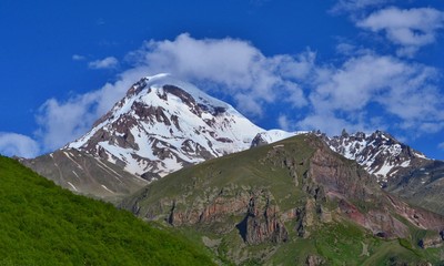 Beautiful Kazbek Mountain near Stepantsminda town. Georgian Valley.