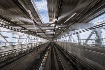 motion-blurred view from a moving train running in tunnel