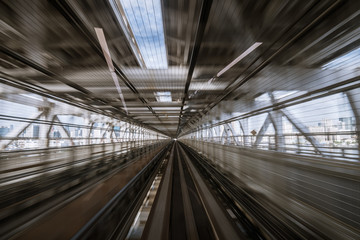 motion-blurred view from a moving train running in tunnel