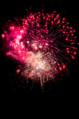 Fototapeta na wymiar Celebration With Bright Colorful Fireworks Over Black Sky