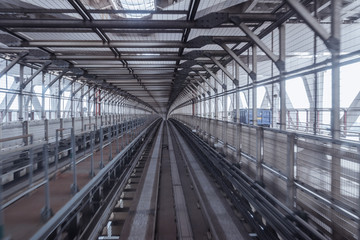tunnel of monorail road view from front window of a moving train running