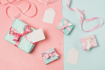 Elevated view of gifts; blank tags and ribbon
