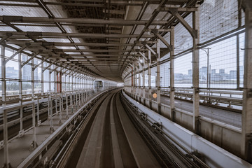 tunnel of monorail road view from front window of a moving train running