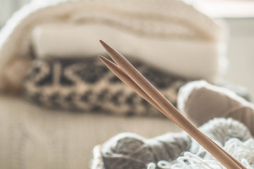 Thread for knitting in a basket closeup. Knitting as a hobby. Accessories for knitting.