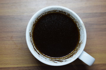 A Cup Of Coffee at Wooden Table Texture