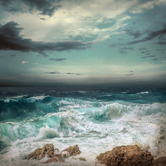 Stormy sea view  near coastline at evening time. Waves, splashed