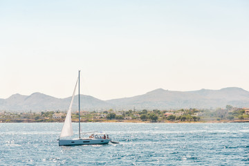 Fototapeta premium Sailboats in a beautiful bay, Aegina island, Greece
