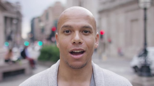 Portrait of handsome mixed race male talking directly to camera
