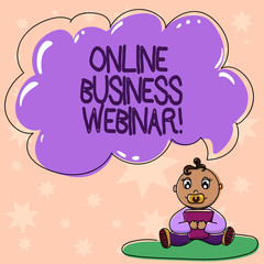 Word writing text Online Business Webinar. Business concept for Seminar that carried over the Web Video conference Baby Sitting on Rug with Pacifier Book and Blank Color Cloud Speech Bubble