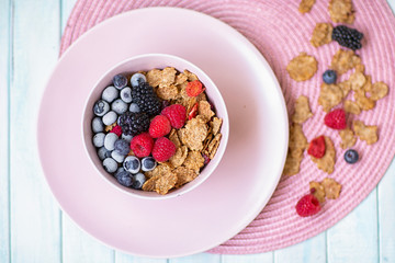 A healthy Breakfast of flakes and berries .biscuits from flakes