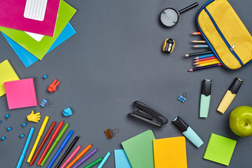 Flat lay photo of workspace desk with school accessories or office supplies.
