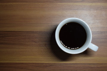 A Cup Of Coffee at Wooden Table Texture