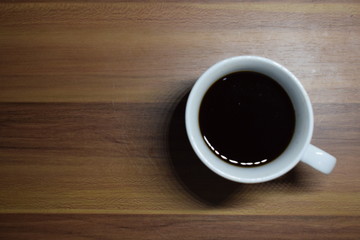 A Cup Of Coffee at Wooden Table Texture
