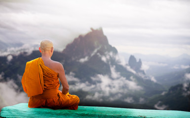 Buddha monk practice meditation infront of mountain