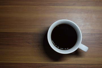 A Cup Of Coffee at Wooden Table Texture