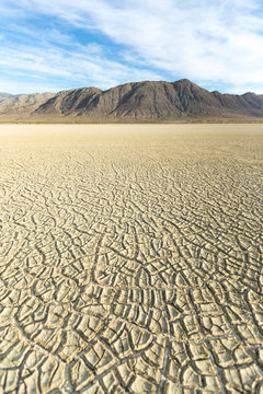 Cracked playa mud texture leading out to the mountains on the Black Rock desert