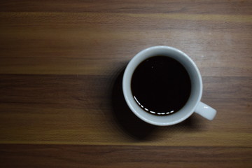 A Cup Of Coffee at Wooden Table Texture