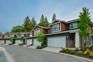 Street of brand new residential triplex houses ready for moving in