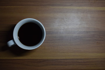 A Cup Of Coffee at Wooden Table Texture