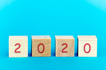 2020 red on wooden cubes, new year's concept