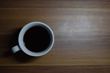 A Cup Of Coffee at Wooden Table Texture