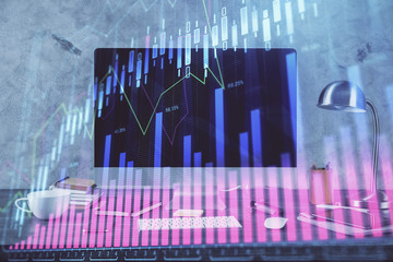 Financial chart drawing and table with computer on background. Double exposure. Concept of international markets.