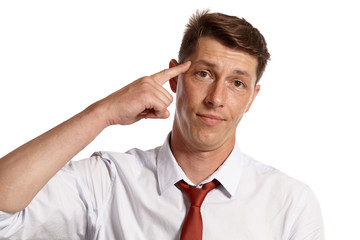 Young man in a classic white shirt and red tie posing isolated on white background.