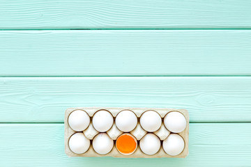 Blog pattern with eggs on mint green wooden background top view copyspace