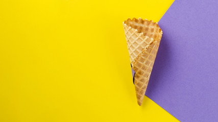 Contrasted background with empty ice cream cone