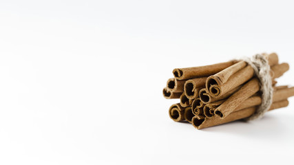 Cinnamon sticks with white copy space background
