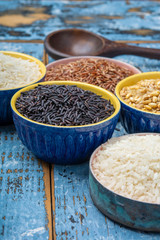 Different types of rice, white basmati, jasmine, arborio, brown and black